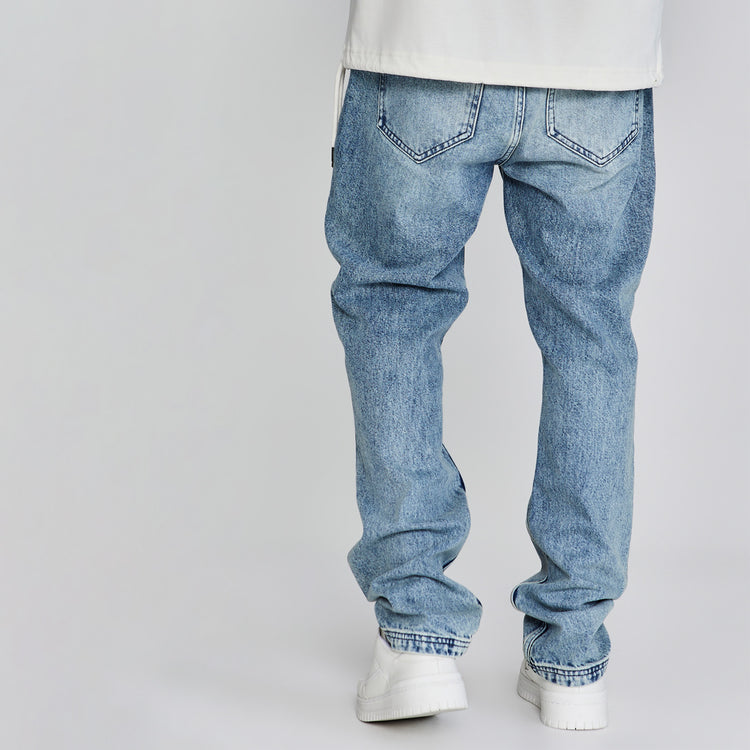 SikSilk Denim. Backshot of models legs, wearing Blue SikSilk Straight Cut Jeans