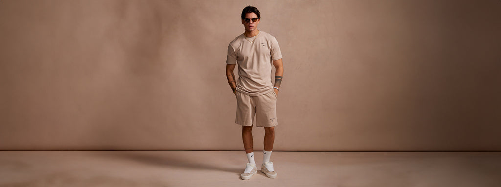 Shop New Arrivals. SikSilk model posing in new shorts & t-shirt set