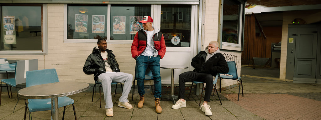 SikSilk Winter Ready. Models sat outside a cafe, wearing SikSilk Jackets