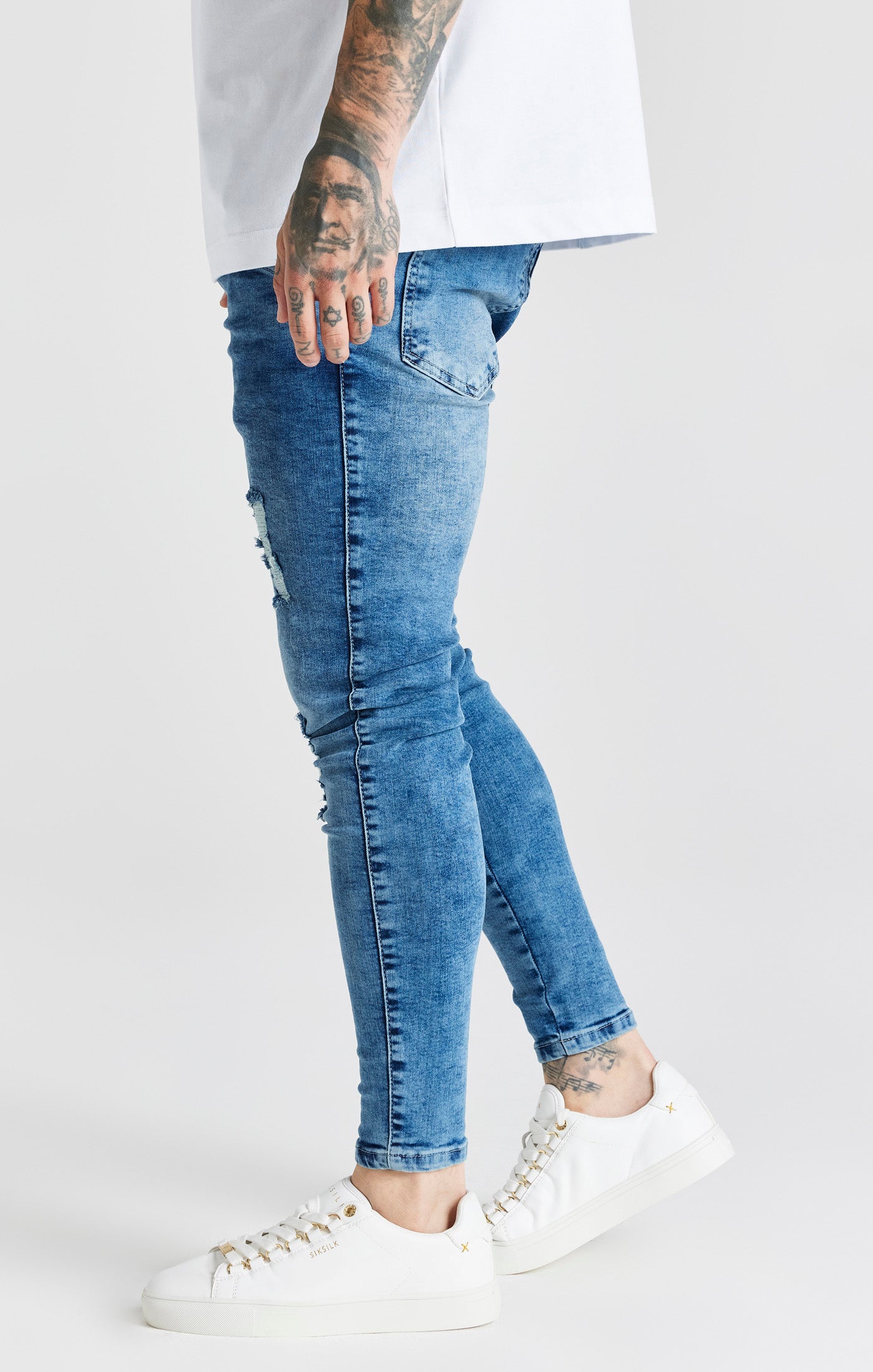 Load image into Gallery viewer, Blue Mid Wash Essential Distressed Skinny Jean (1)