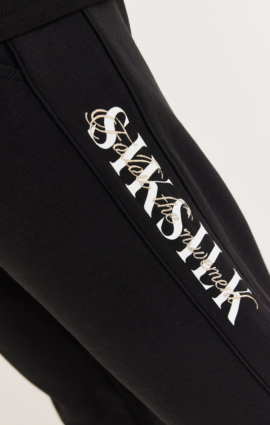Black Script Logo Panelled Trousers